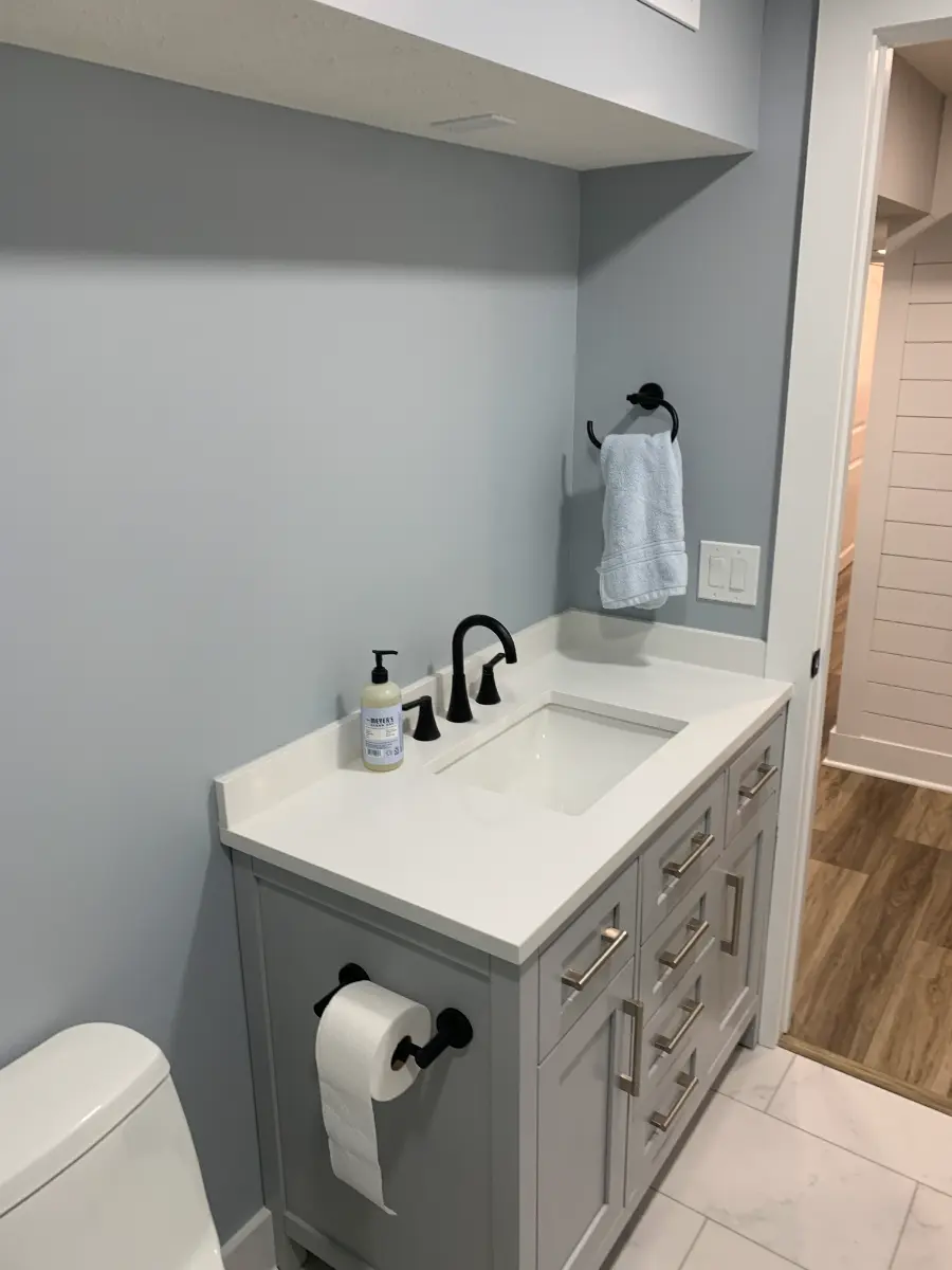 basement renovation with built-in closets and vanity, after