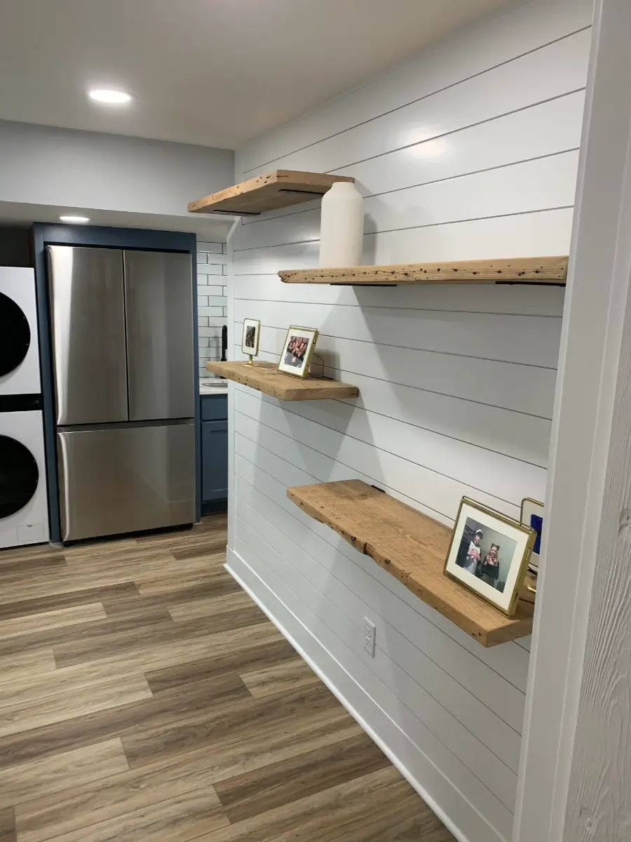 basement renovation with shiplap wall and gaming area, after
