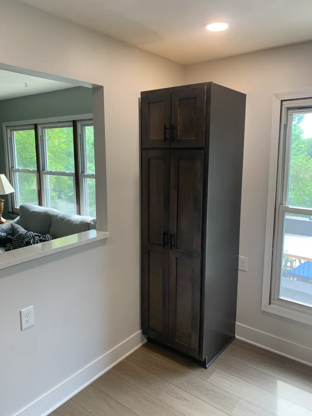 Custom built-in shelving and trim work flanking a fireplace