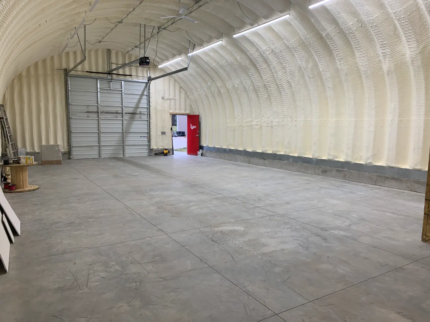 Baseball Quonset building exterior and finished interior by Verespej Construction, after