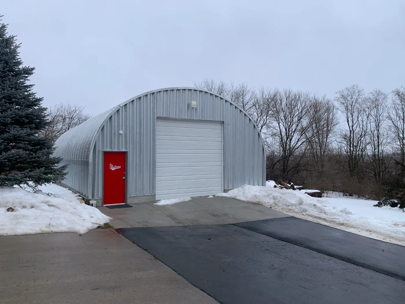 Baseball Quonset building exterior and finished interior by Verespej Construction, after