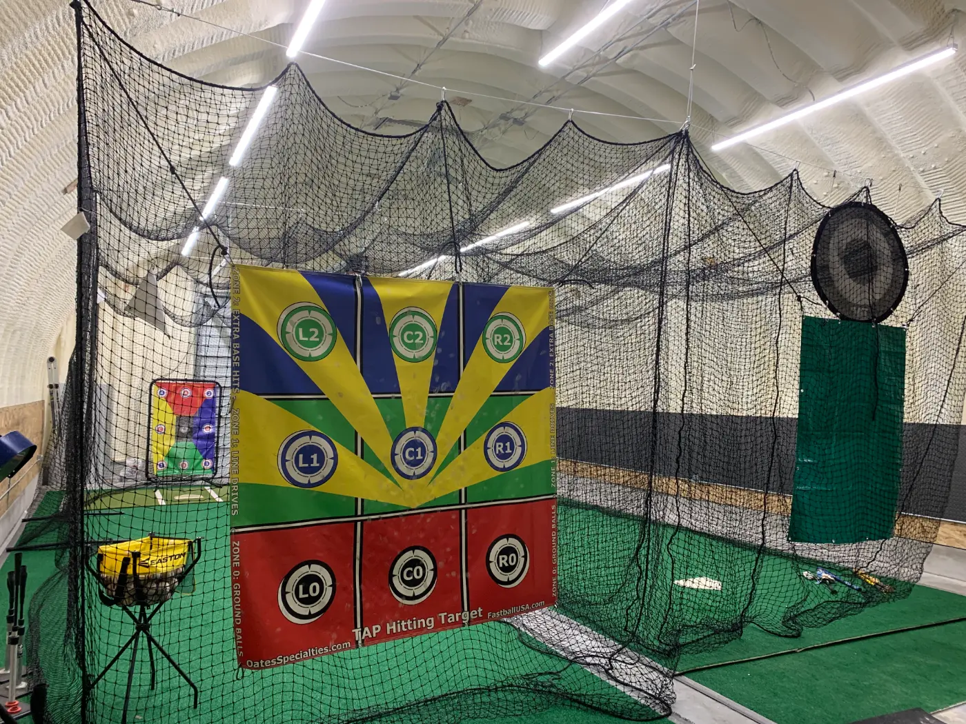 Baseball Quonset interior batting cages and training setup by Verespej Construction, after