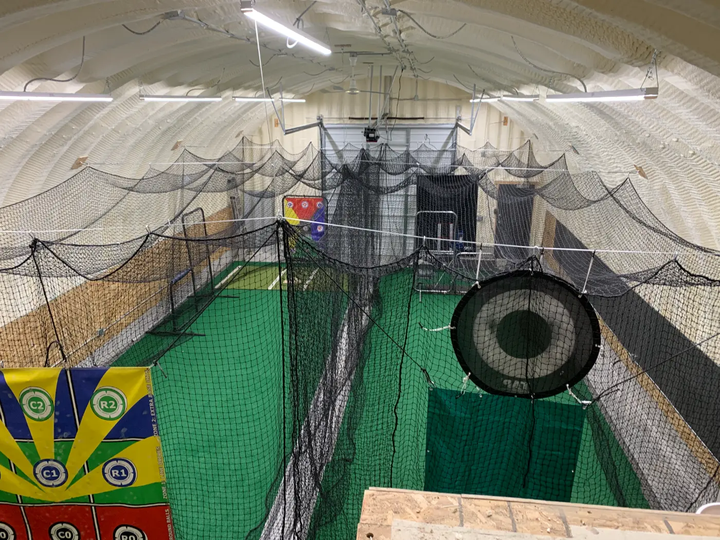 Baseball Quonset interior batting cages and training setup by Verespej Construction, after
